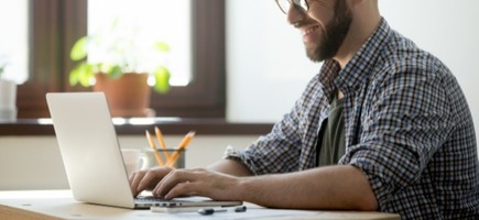 Happy male writing positive mail client 1163 3986